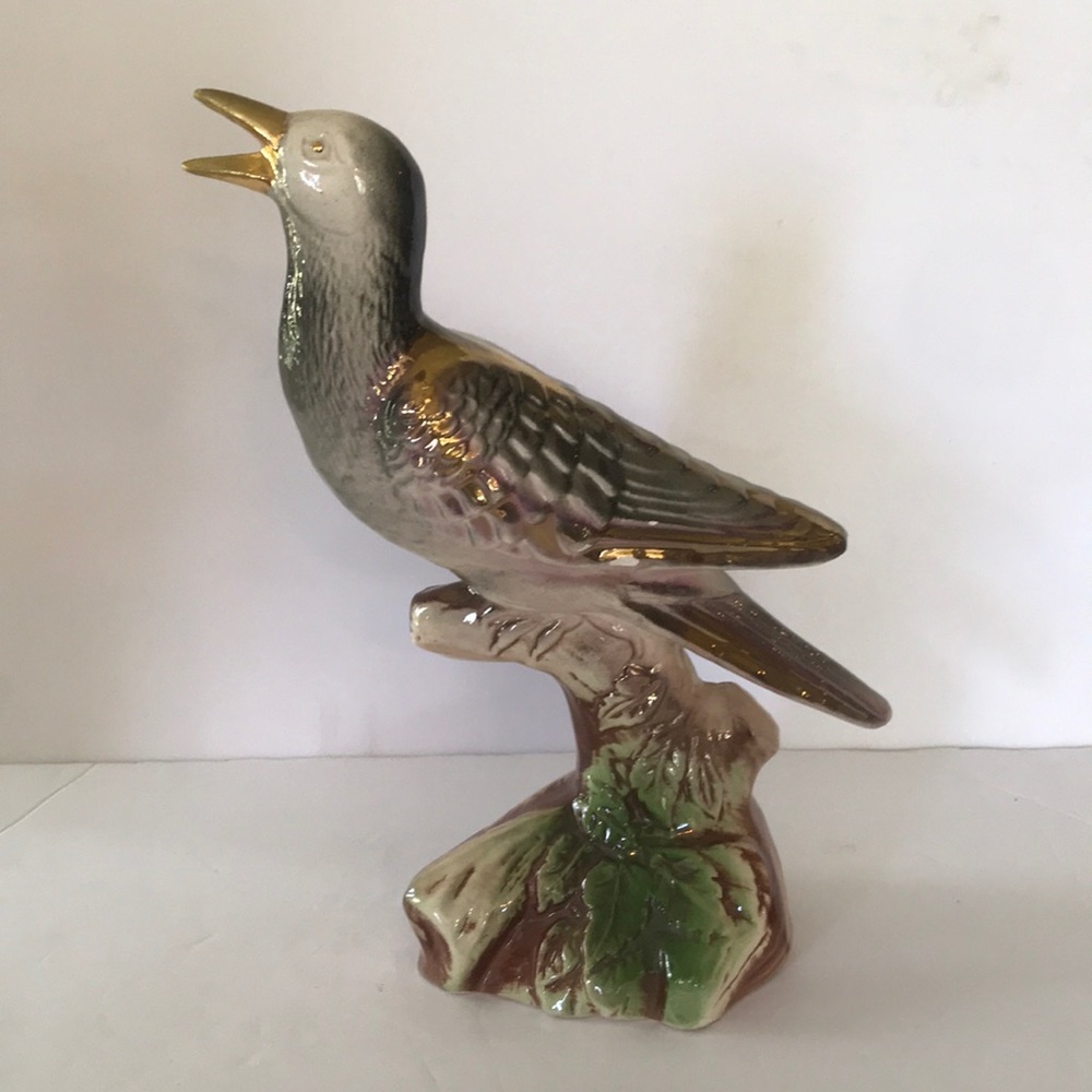 Ceramic Bird Perched on Tree
